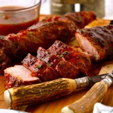 A sliced pork tenderloin covered with apricot glaze.