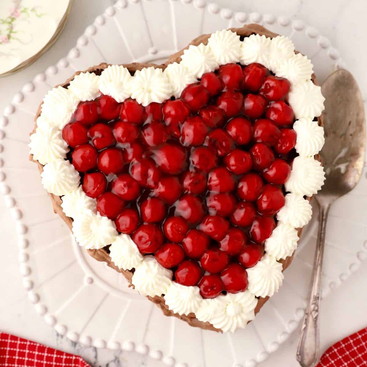 Heart-Shaped Chocolate Cake with Cherries - Grits and Pinecones