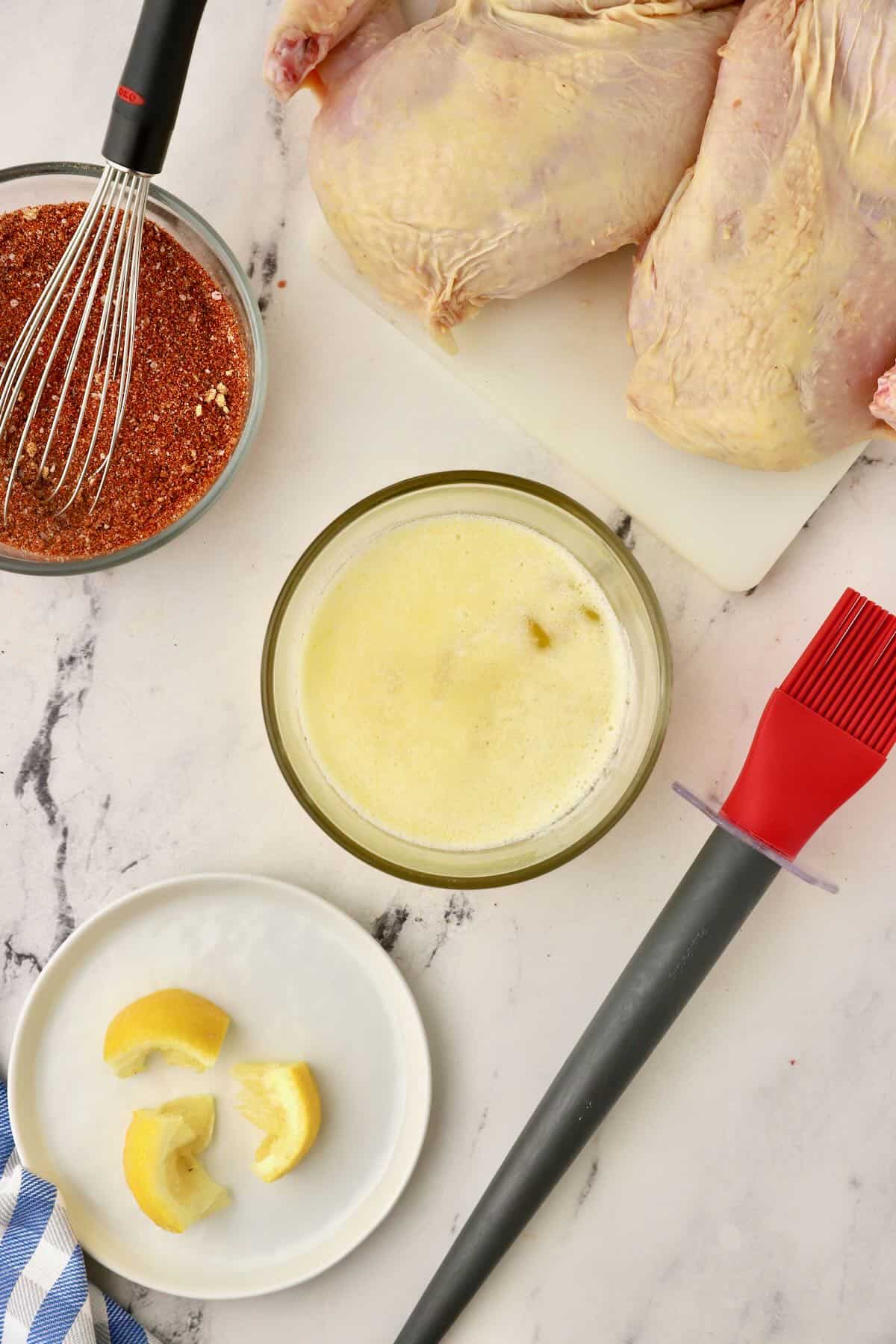 Butter and lemon juice mixed together in a small bowl. 