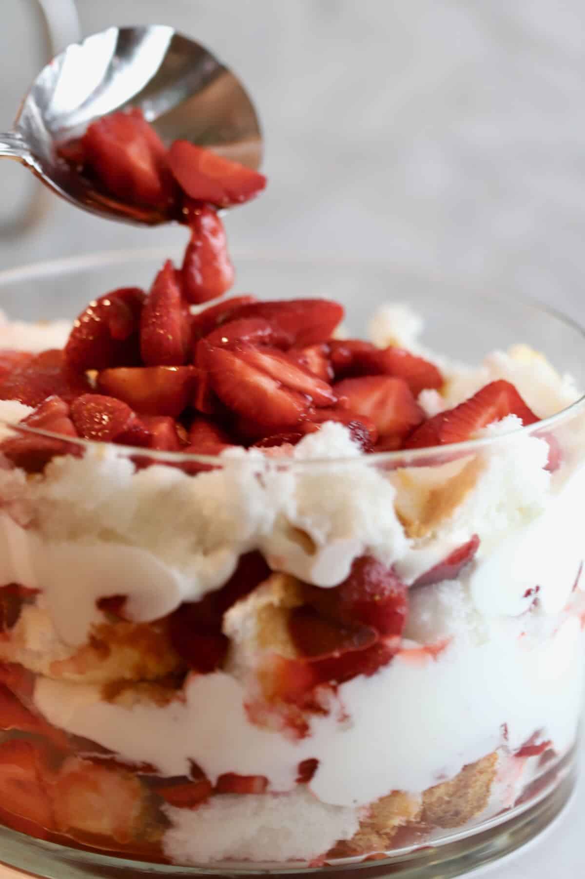 Topping trifle layers with strawberries. 