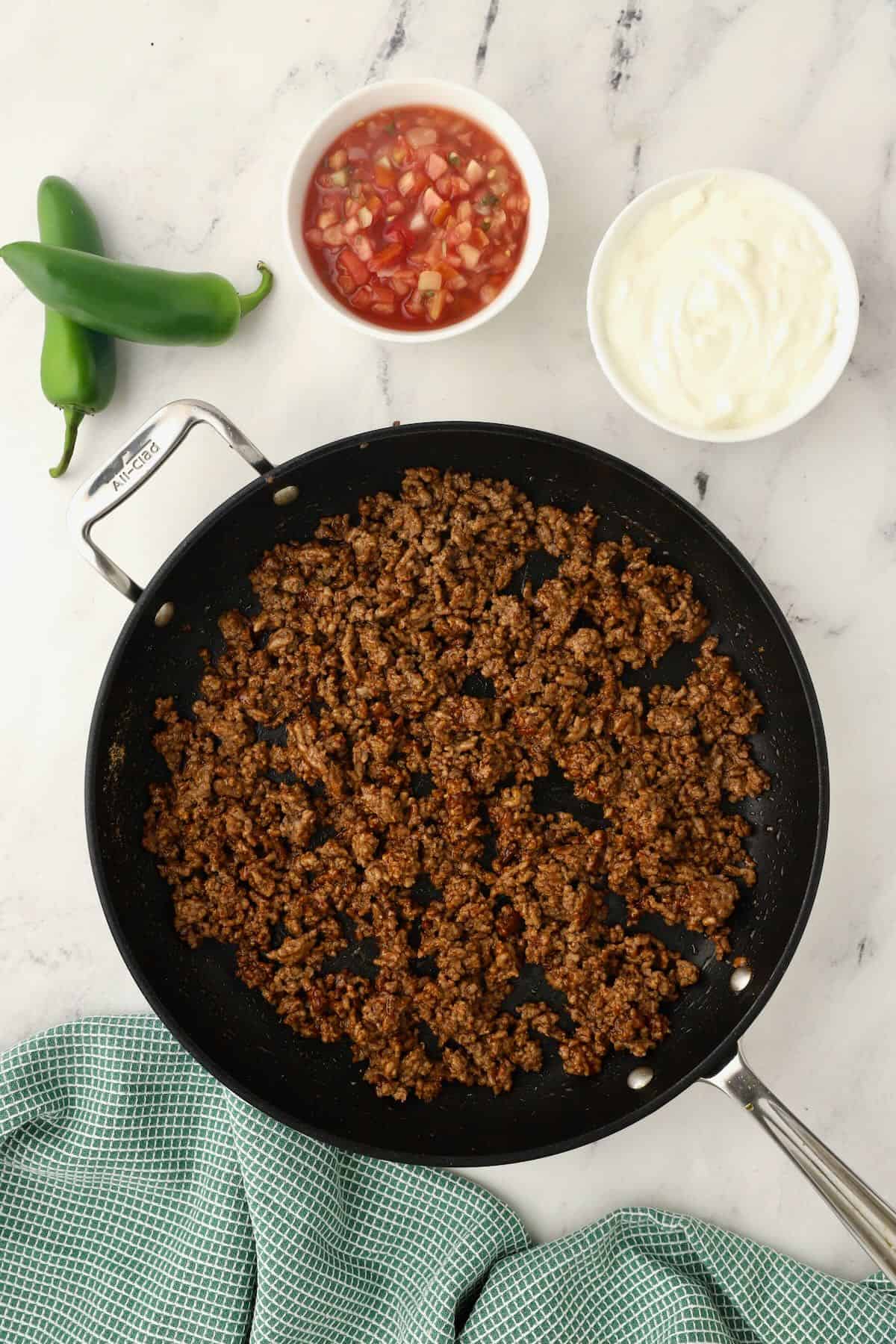 Browning ground beef in a skillet. 