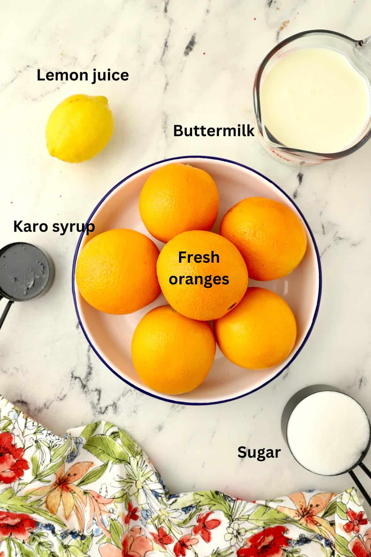 Ingredients for sherbet including oranges, buttermilk, and Karo syrup.