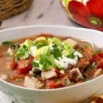 Pinterest pin, with a bowl of Mexican Pork Stew, topped with sour cream.