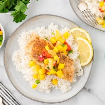Pan seared red snapper topped with mango salsa served over rice.