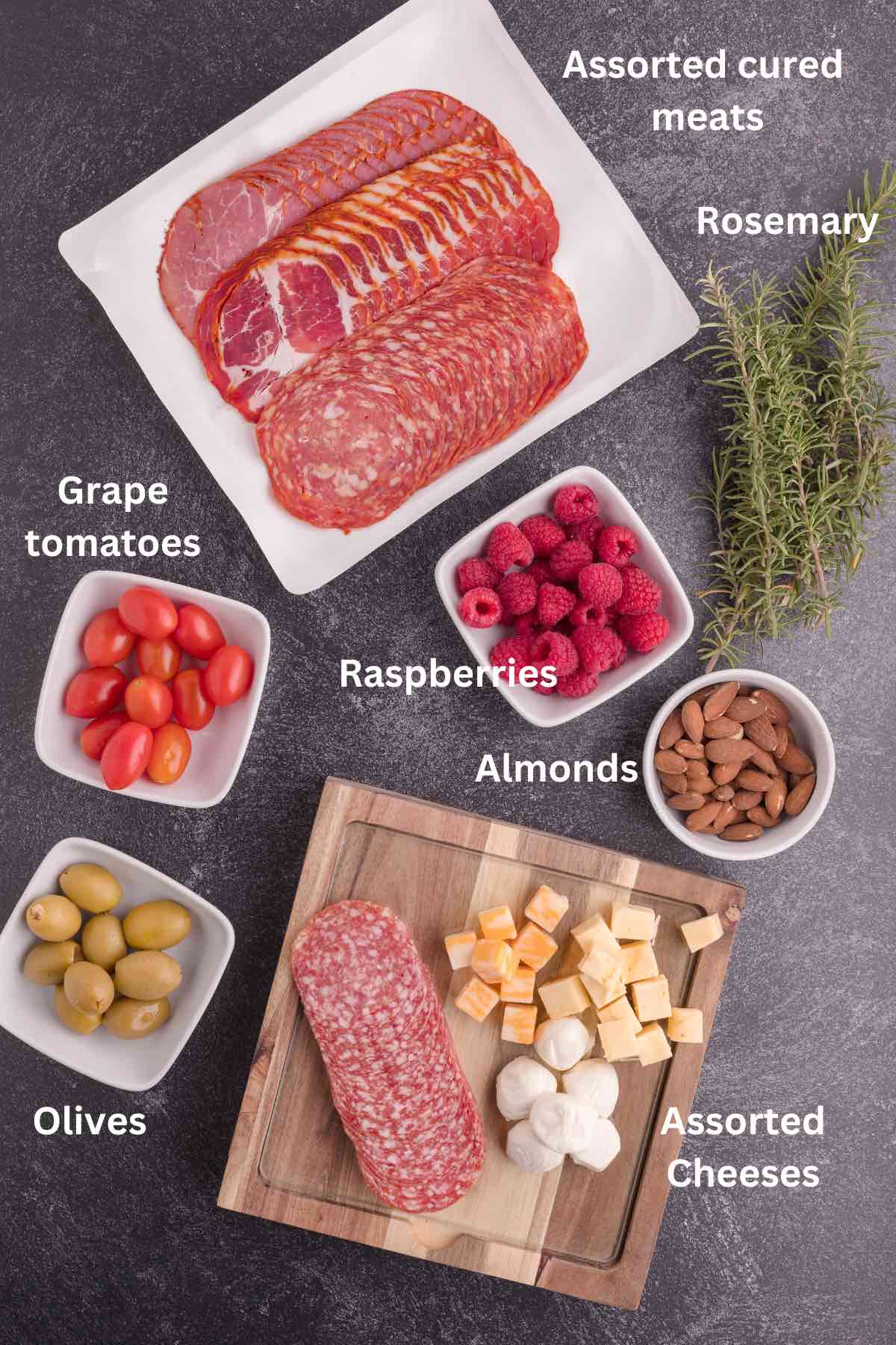 Ingredients for a charcuterie board include sliced cured meats, cheeses, and vegetables. 