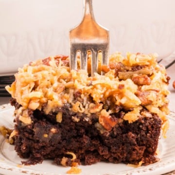 A German Chocolate Brownie with a fork stuck in it.