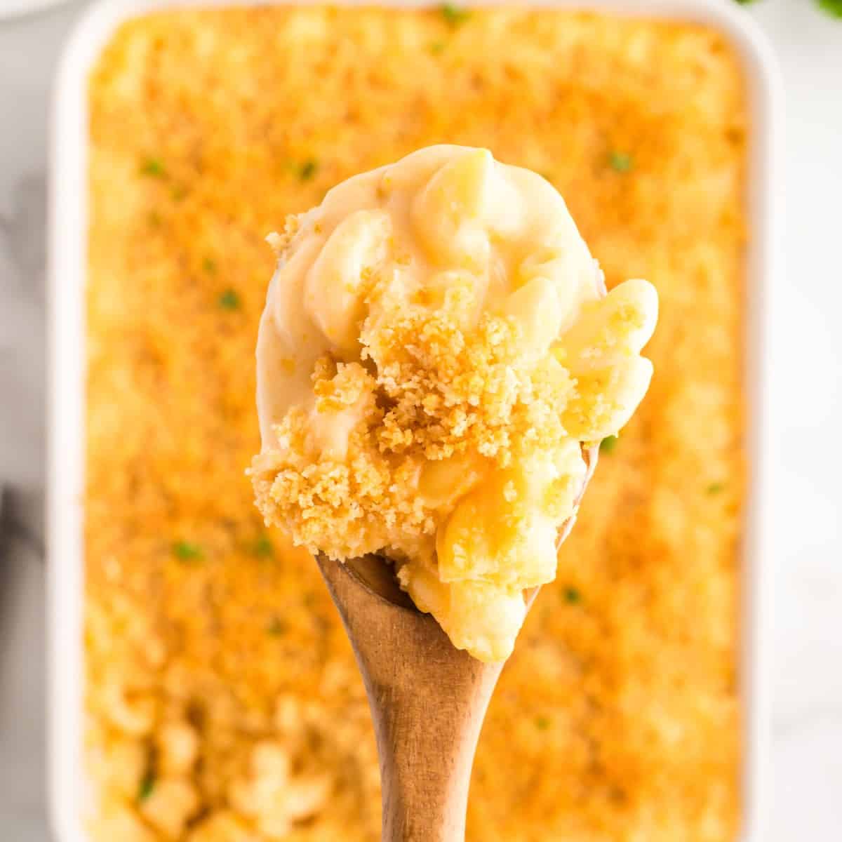A spoonful of Southern Mac and Cheese over the casserole.