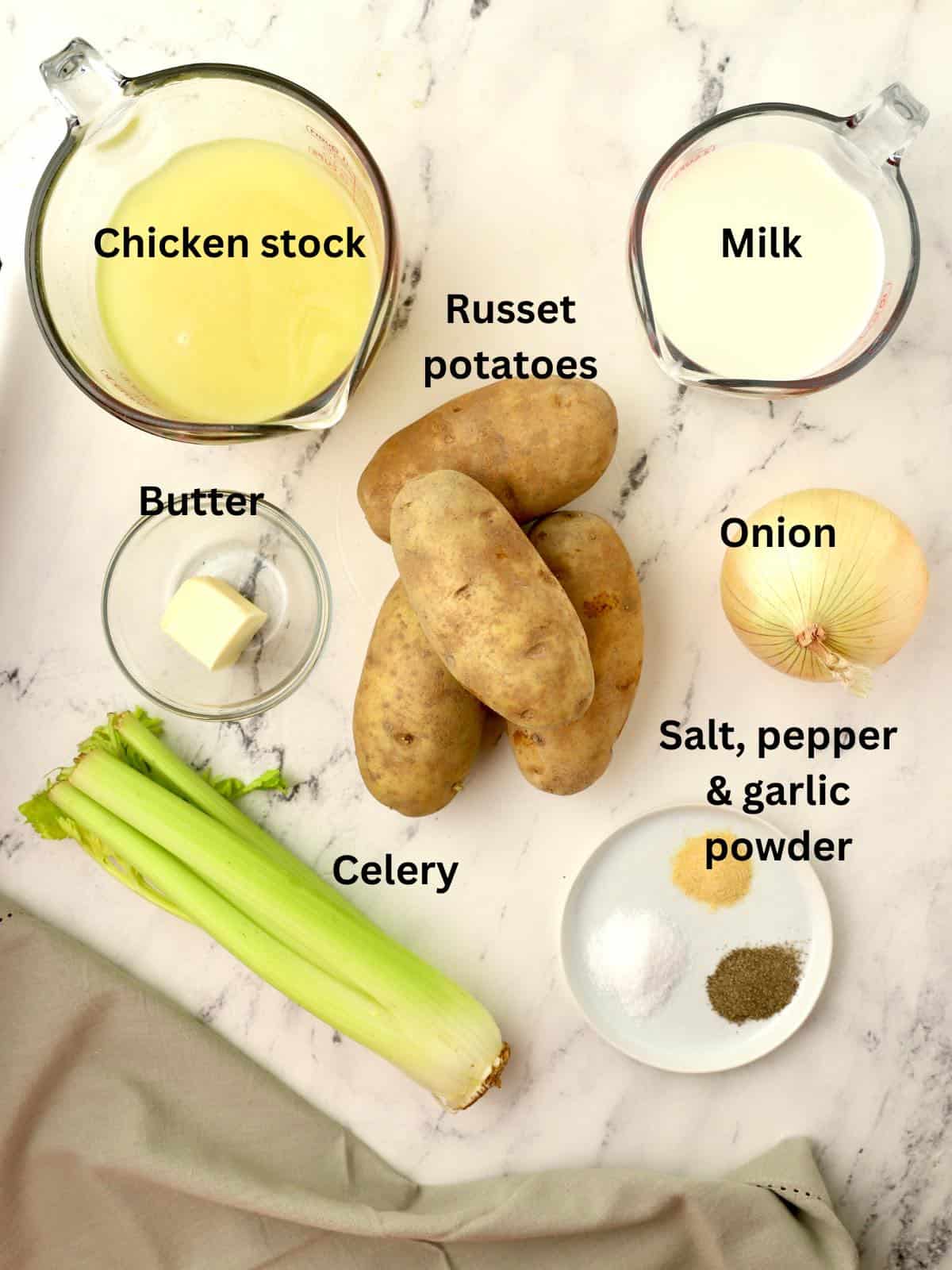 Ingredients for potato soup include potatoes, onion, celery, and chicken stock. 