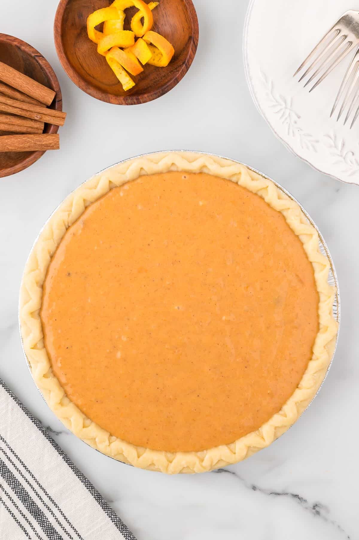 Sweet potato pie ready to be baked in the oven. 