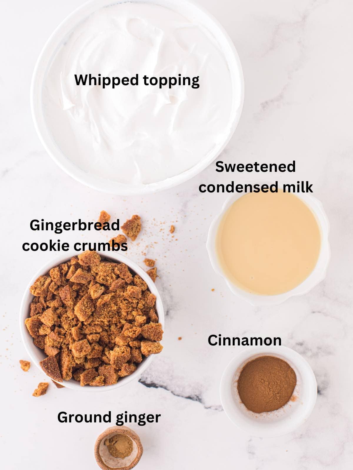 Ingredients for gingerbread ice cream include whipped topping and cookie crumbs. 