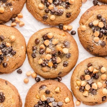 Just baked Butterscotch and Chocolate Chip Cookies on parchment paper.