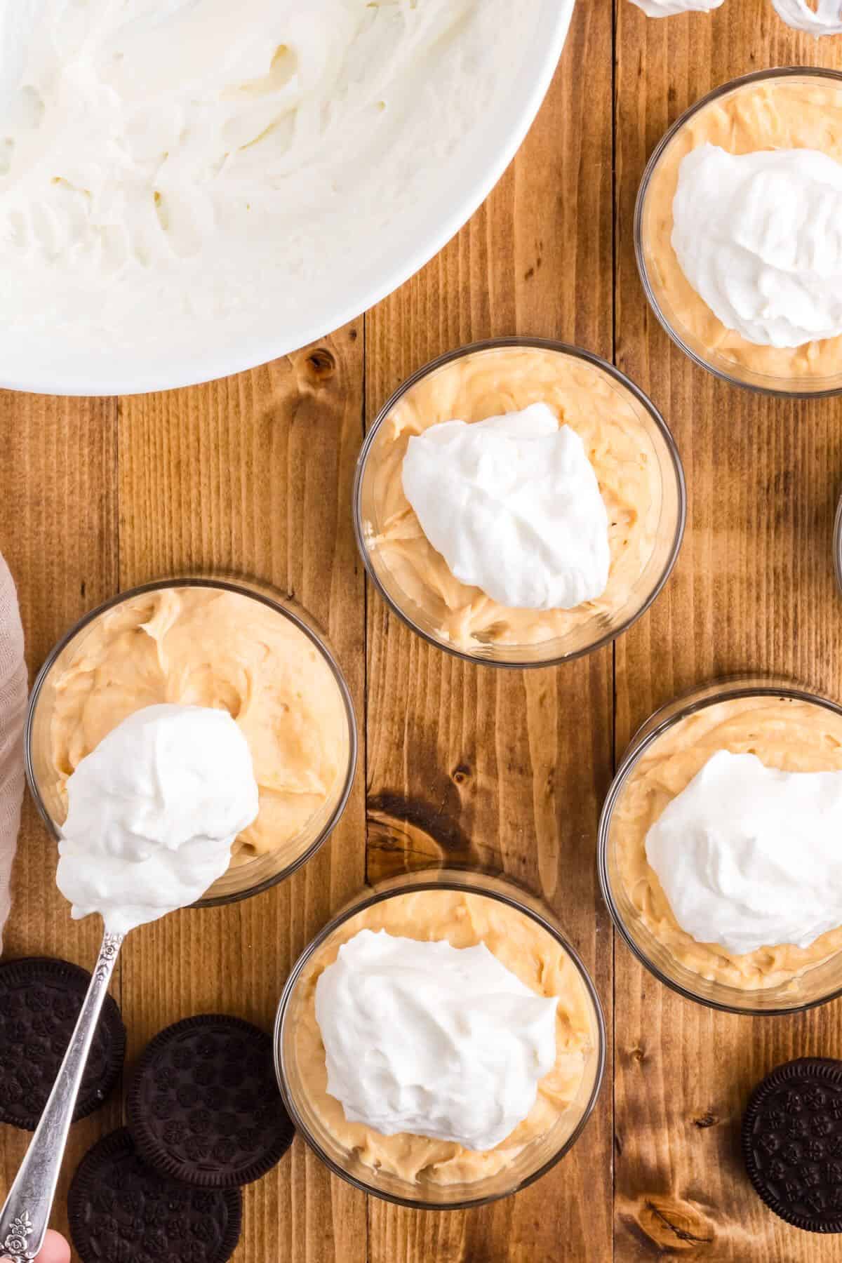 Peanut butter mousse topped with dollops of whipped cream. 