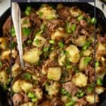 Pinterest pin showing a cast iron skillet full of roast beef hash.