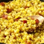 Pinterest pin showing fried corn in a cast iron skillet.