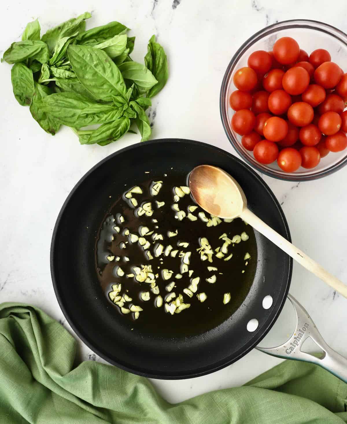 Chopped garlic cooking in a skillet. 