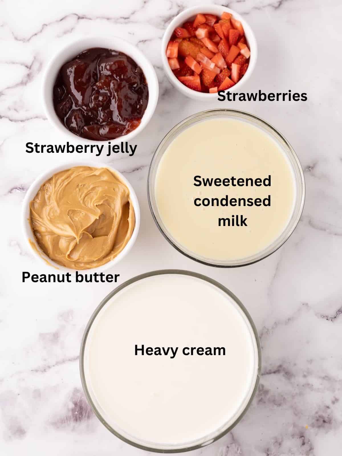 Ingredients for PB&J Ice Cream include peanut butter, jelly, heavy cream, and condensed milk. 