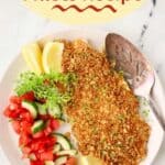Pinterest pin showing a snapper fillet topped with panko on a white plate.