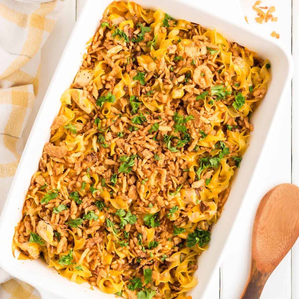 French Onion Soup Chicken Casserole in a white rectangle baking dish.