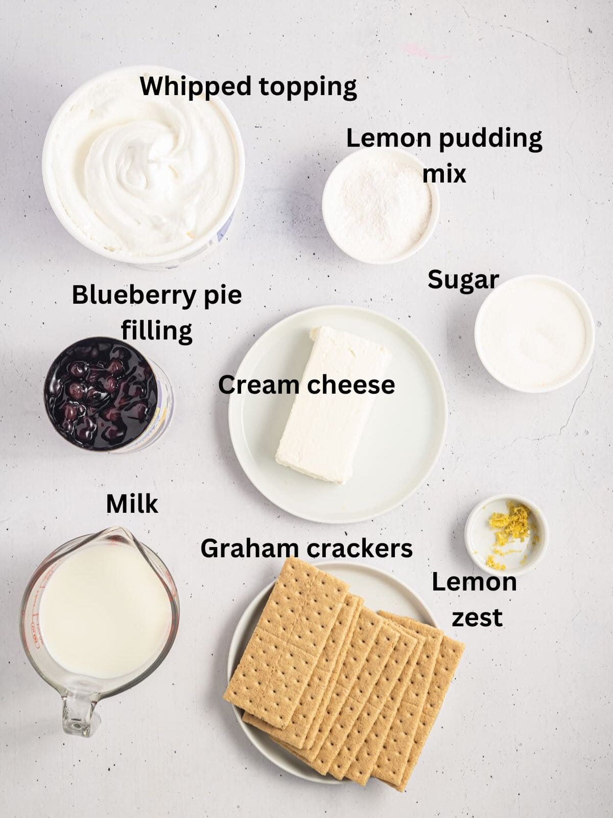 Ingredients for an icebox cake include blueberry pie filling and graham crackers. 