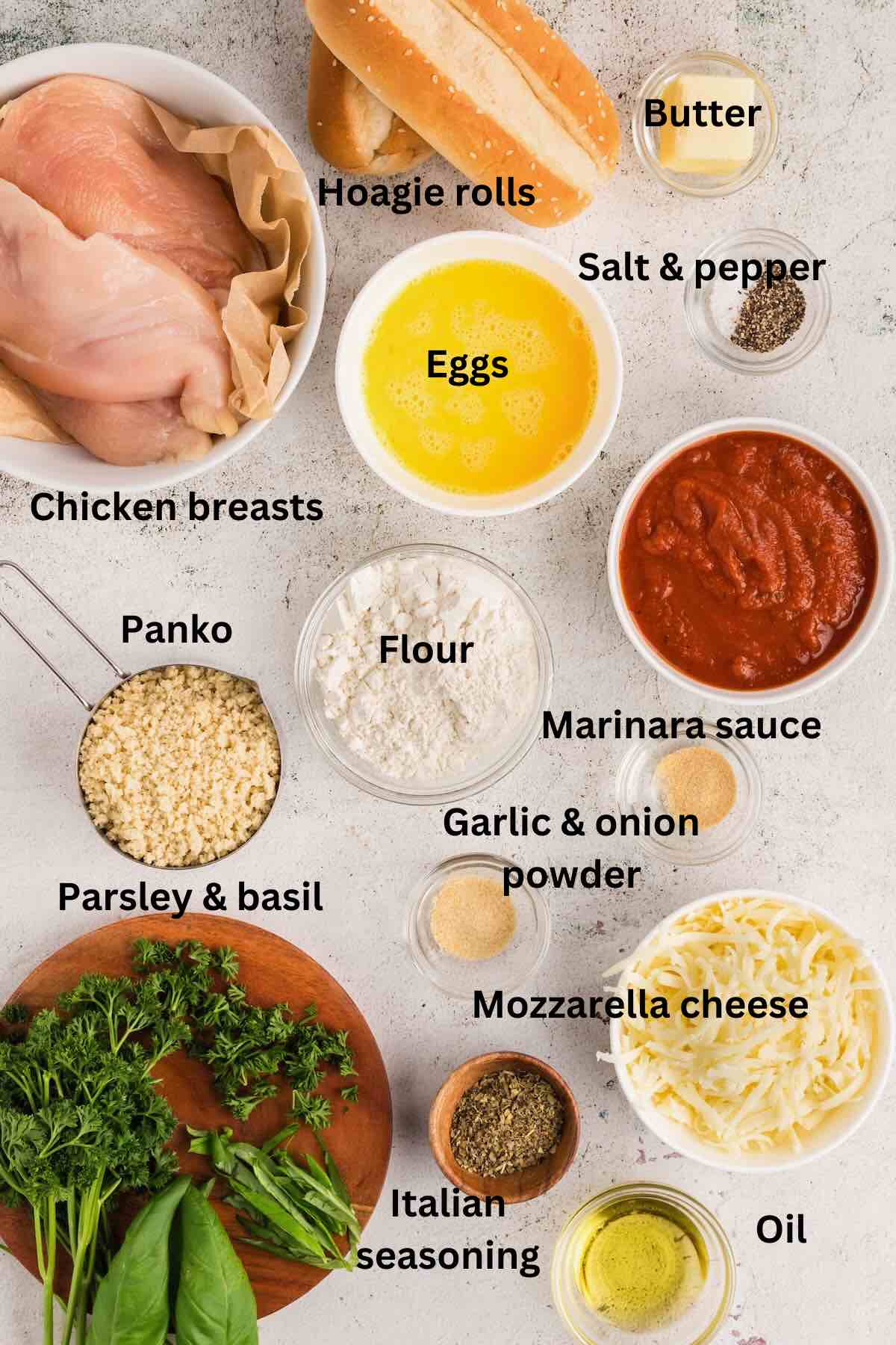 Ingredients for a chicken parmesan sandwich include chicken breasts, marinara sauce, basil, panko and mozzarella cheese. 