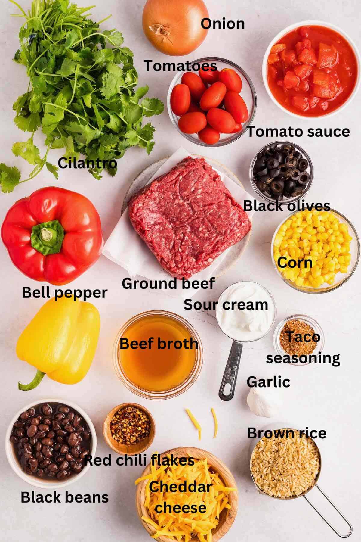 Ingredients for Mexican Beef Rice Skillet including ground beef, canned tomatoes and bell peppers. 