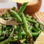 Pinterest pin showing a plate of green beans and a fork full on top.