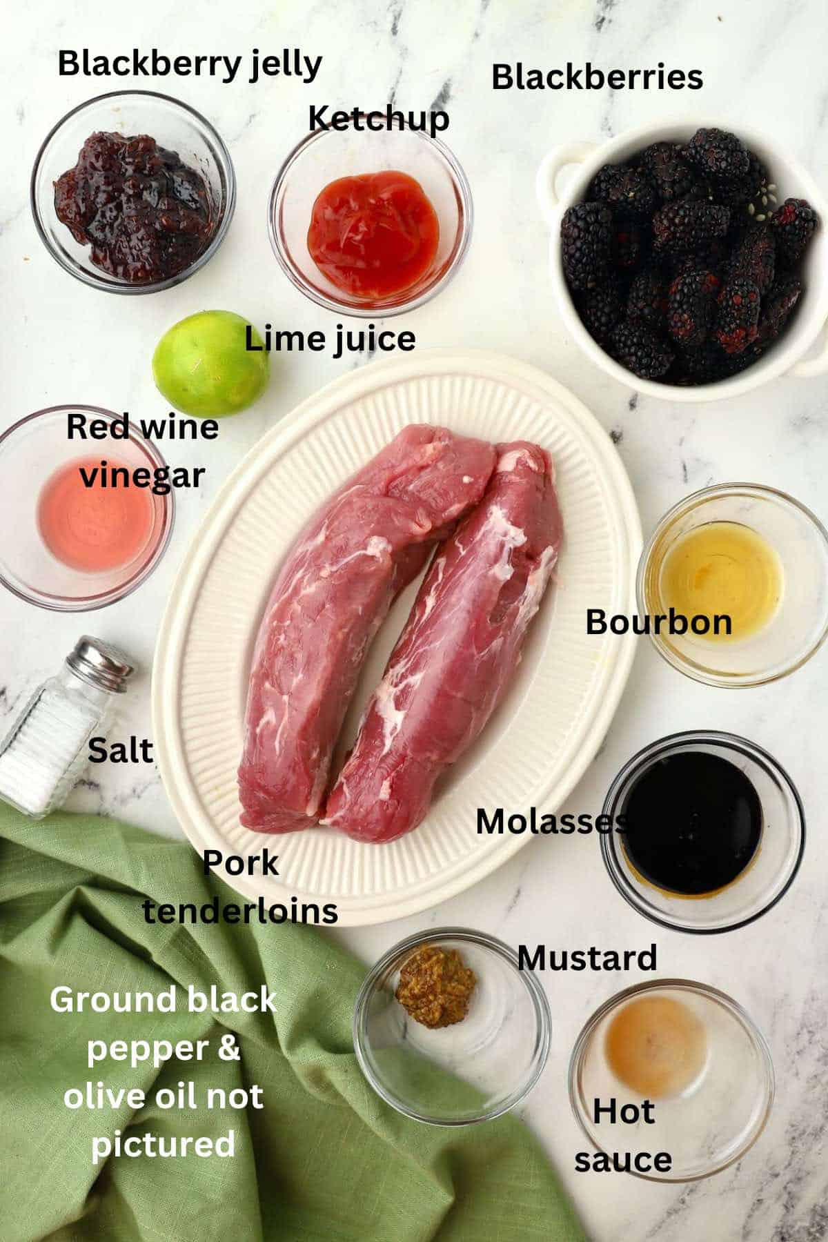 Ingredients to make pork tenderloin with blackberry sauce including fresh blackberries and blackberry jelly. 