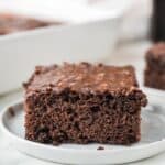 A slice of Dr Pepper Cake which is a chocolate sheet cake with chocolate icing.