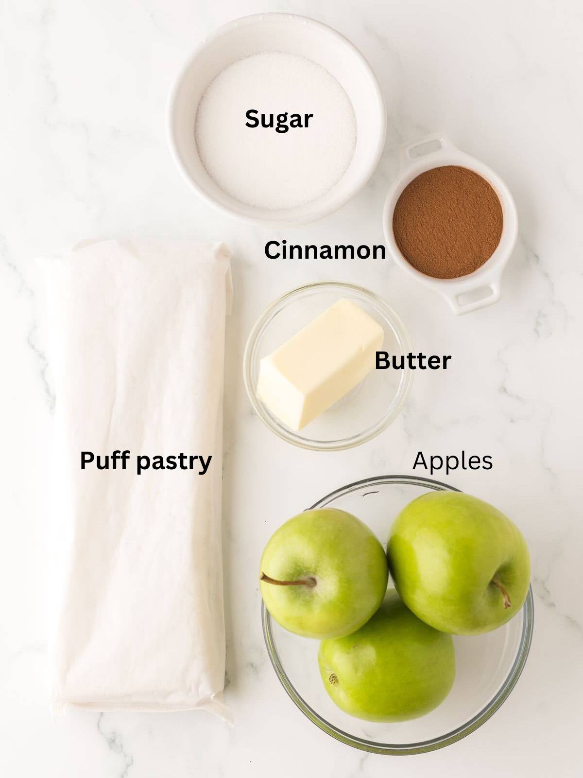 Ingredients for apple pastries include apples, puff pastry, butter, and sugar. 