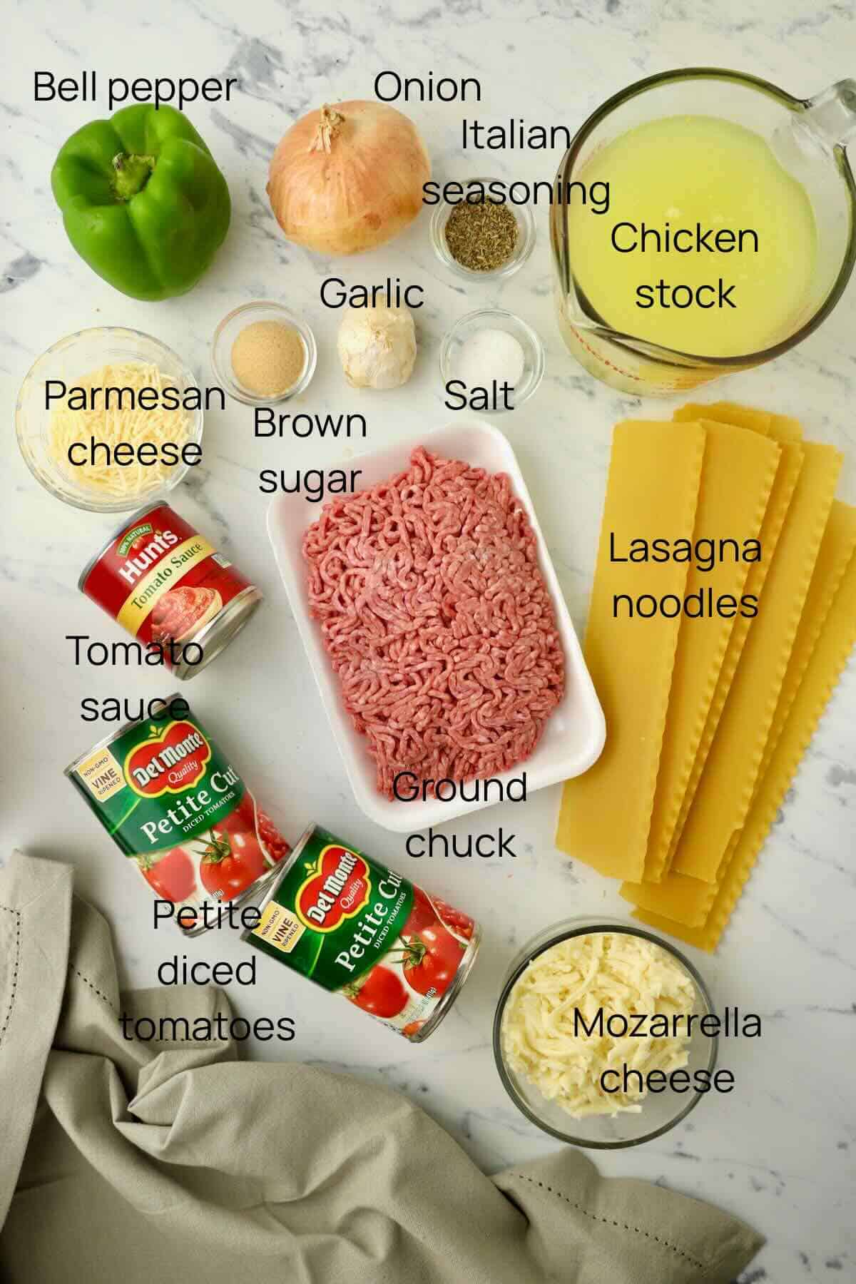Ingredients for lasagna soup includes ground chuck, bell pepper, onion, garlic, canned tomatoes, chicken stock, and seasonings. 