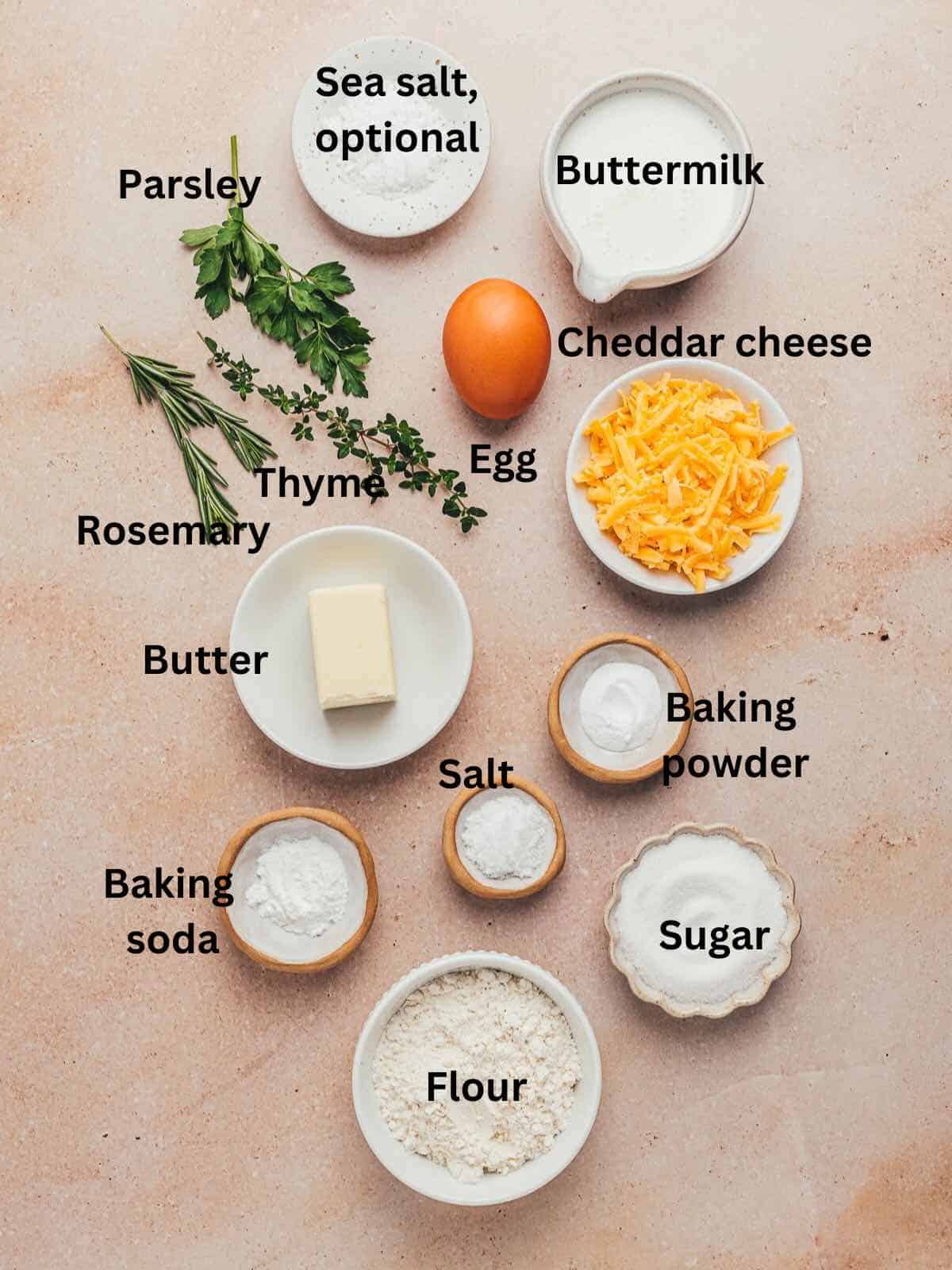 Cheese bread ingredients include herbs, flour, butter, shredded cheese, baking powder and baking soda. 