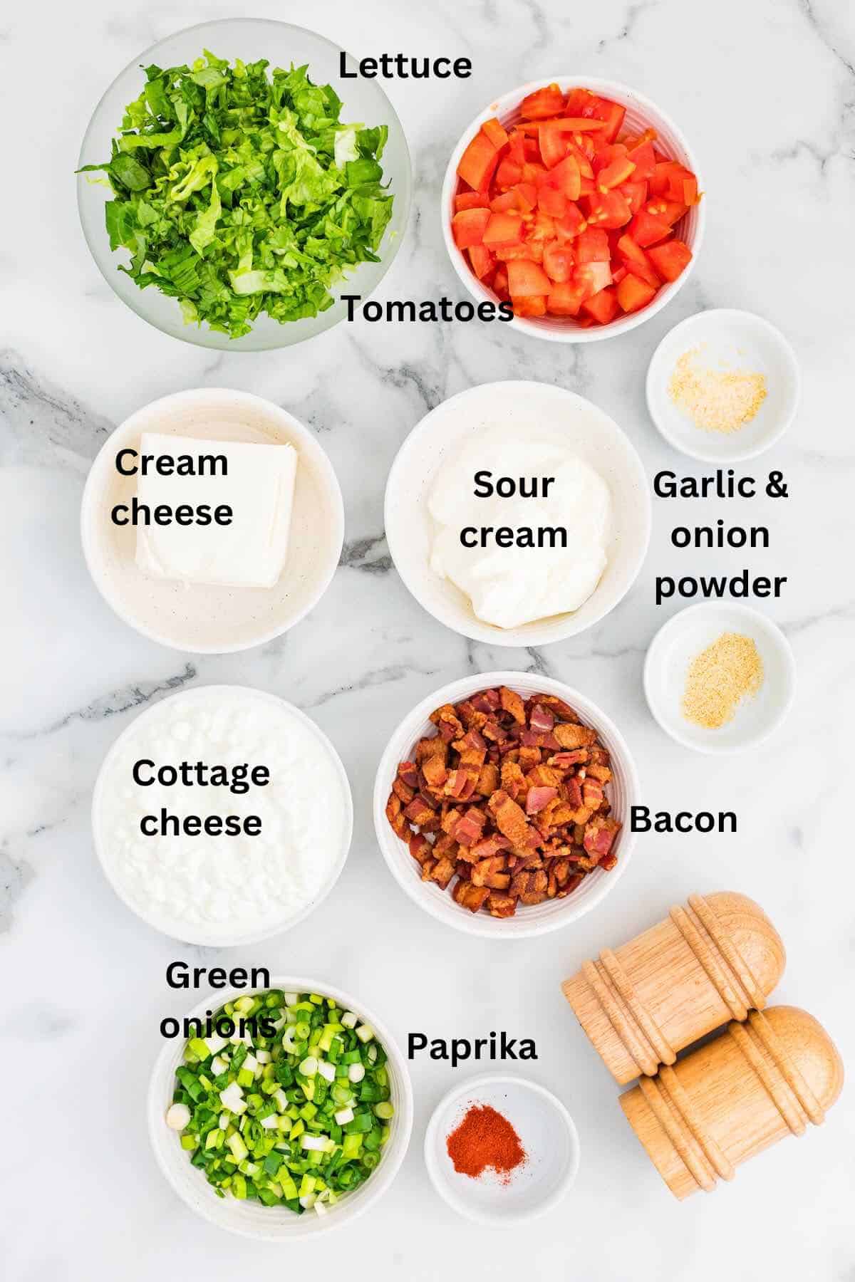 Ingredients for BLT Dip including cottage cheese, sour cream, and cream cheese. 