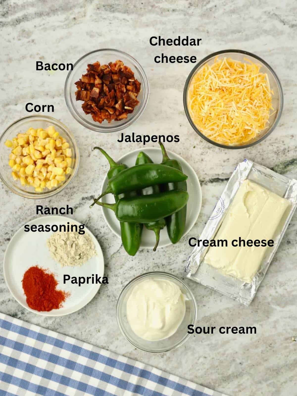 Jalapenos, corn, shredded cheese, chopped bacon, sour cream, and cream cheese. 