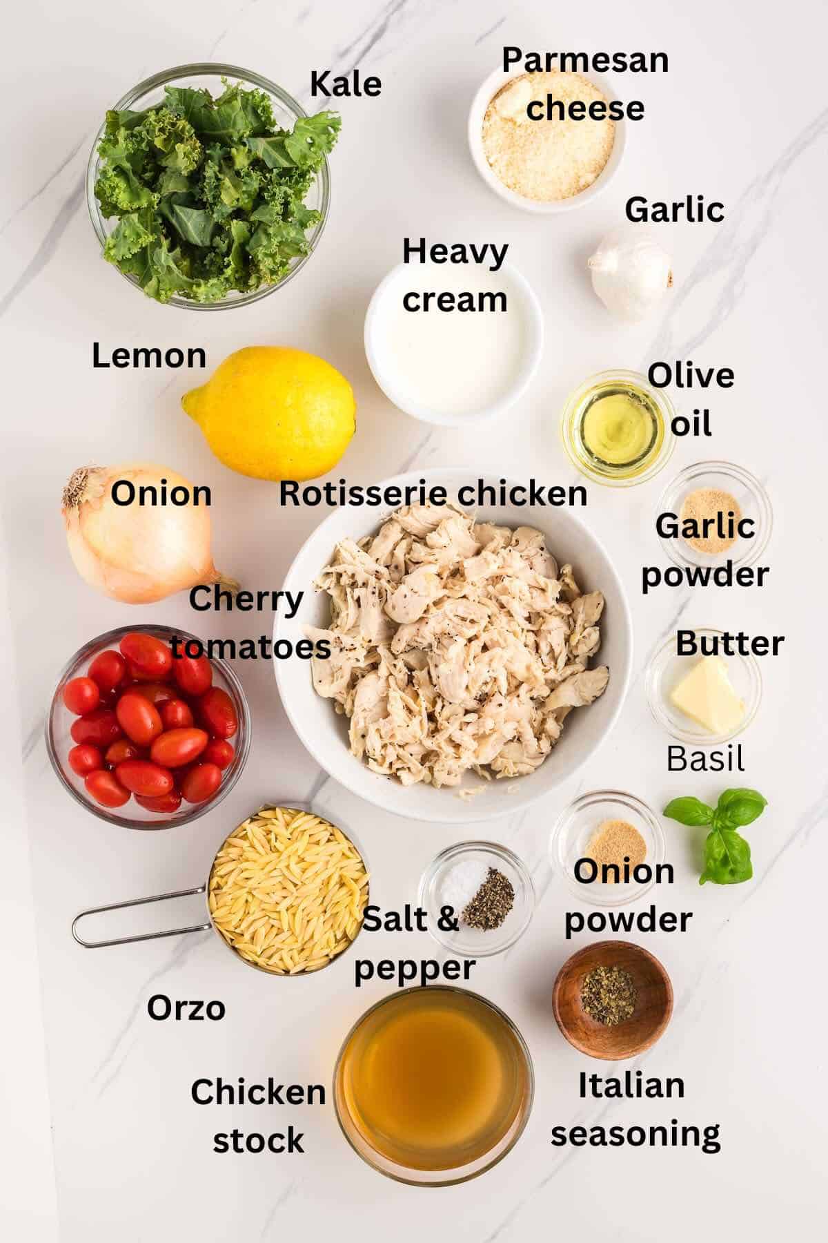 Shredded chicken, cherry tomatoes, kale, chicken stock, seasonings, basil, lemon and a bowl of heavy cream.