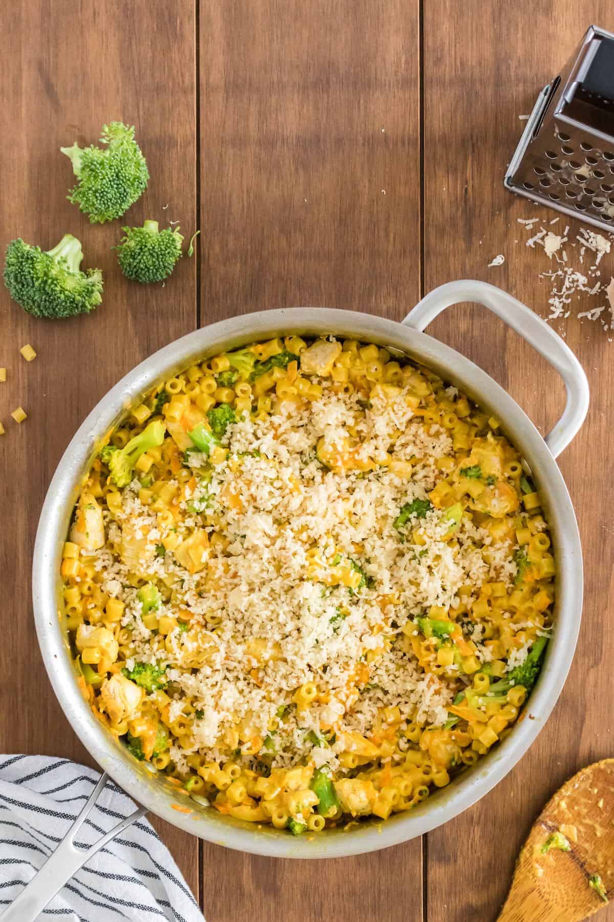 A topping of panko, butter and parmesan cheese is added to the top of chicken broccoli pasta.
