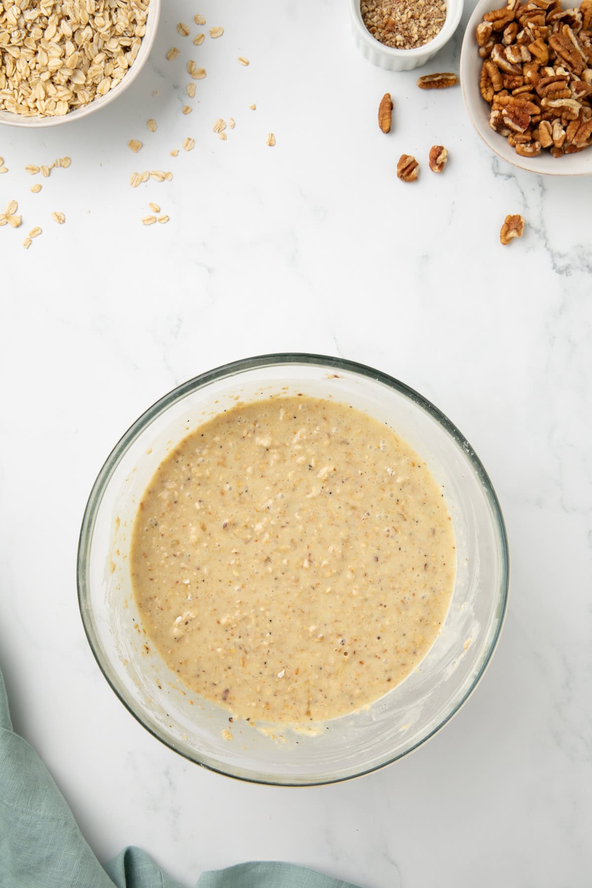 Dry ingredients for this muffin recipe are added to the wet ingredients so the oat flour can absorb the liquid. 