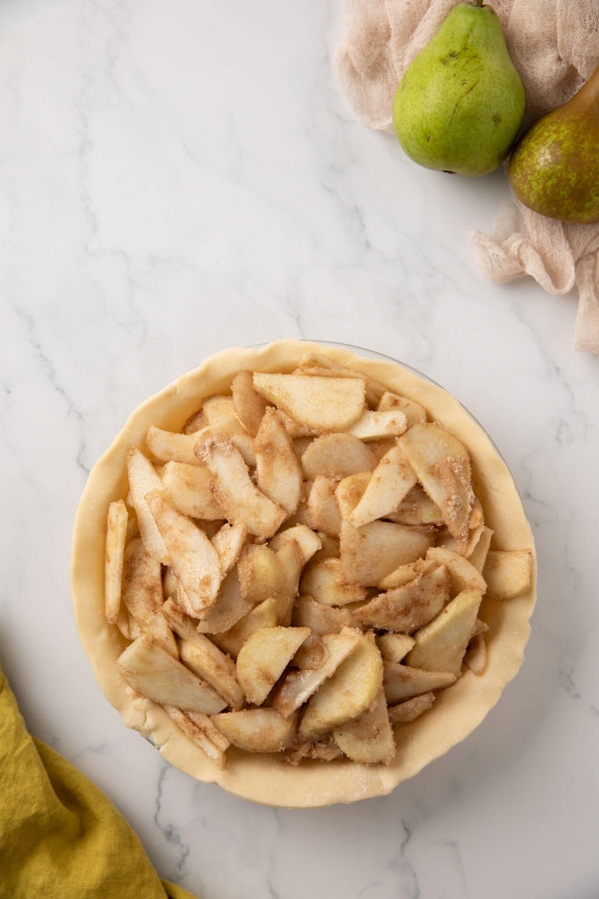 Pear pie filling in an unbaked pie crust. 