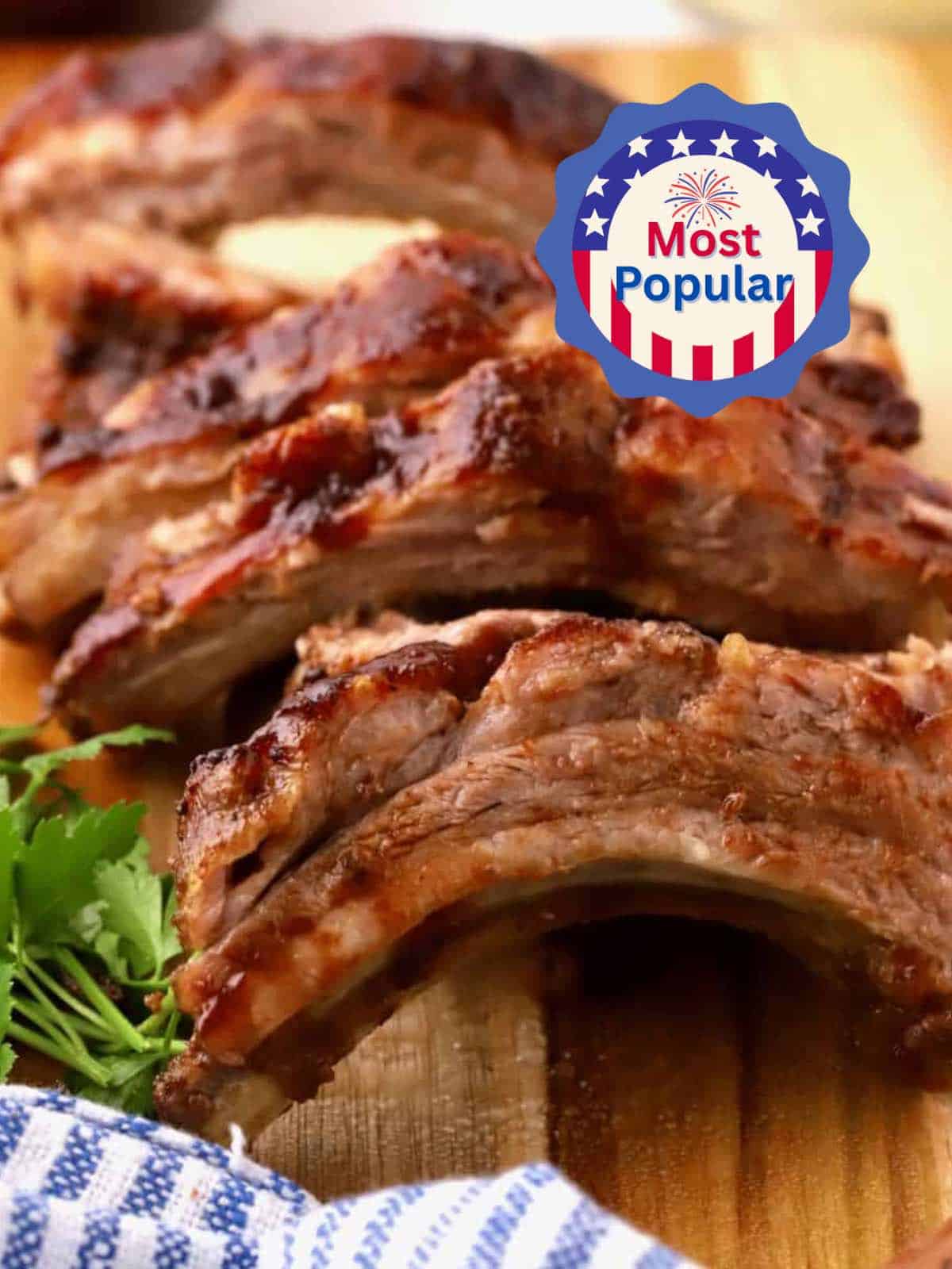 Sliced oven-baked baby back ribs on a cutting board.