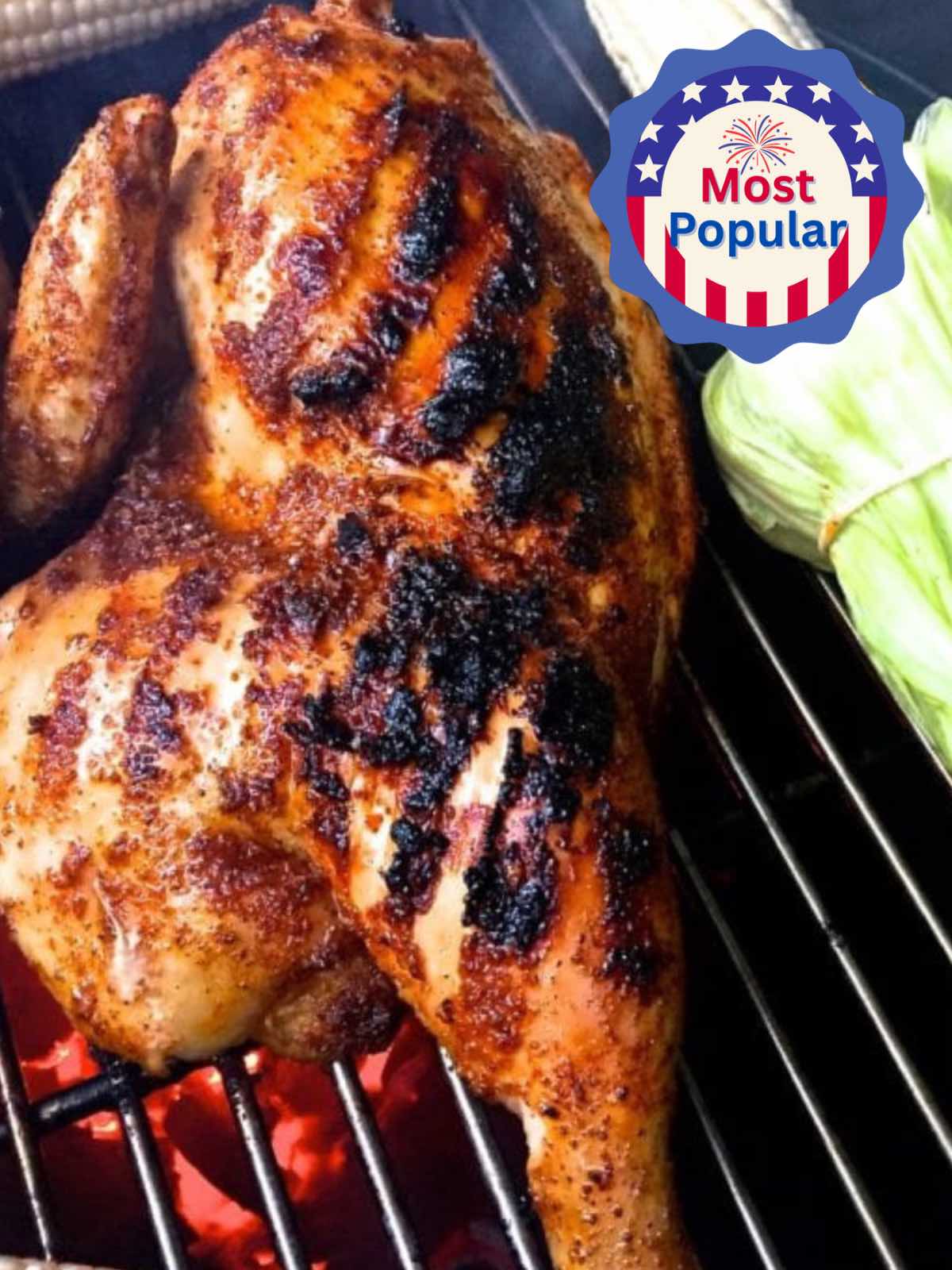 A half chicken being grilled on a charcoal grill and an ear of corn. 