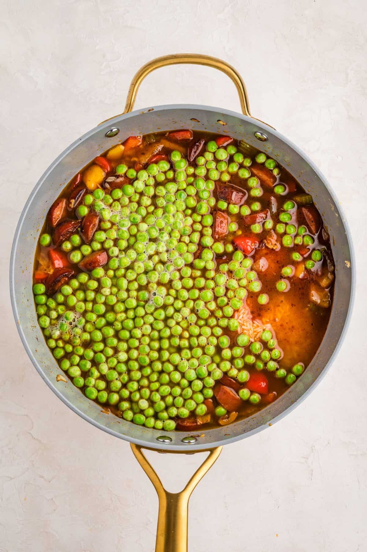 Chicken stock, peas, and rice were added to the sausage and veggies. 