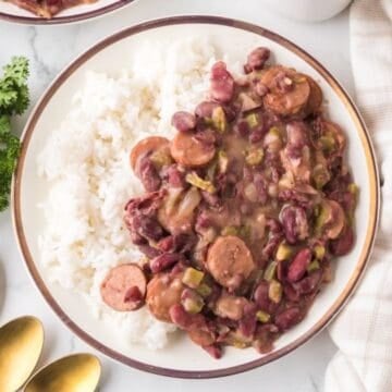 A plate full of Cajun Red Beans served over white rice.