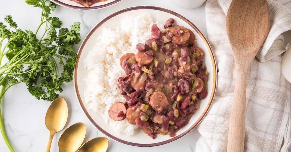 A plate full of Cajun Red Beans served over white rice.
