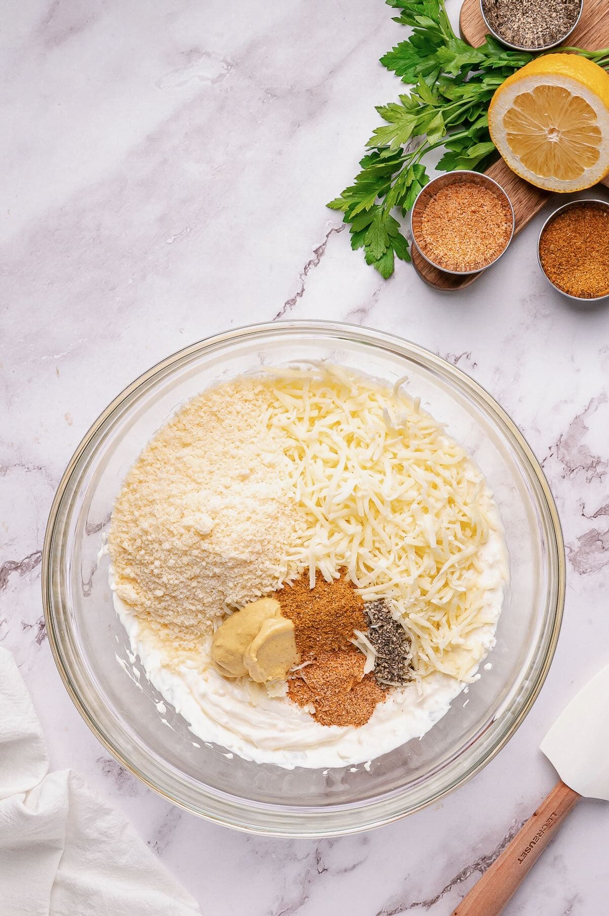 Mozzarella cheese, Parmesan cheese and seasonings are added. 