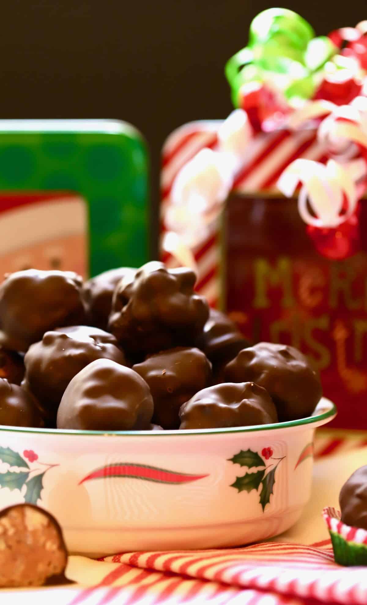 A Christmas bowl full of Chocolate Billionaires candy. 