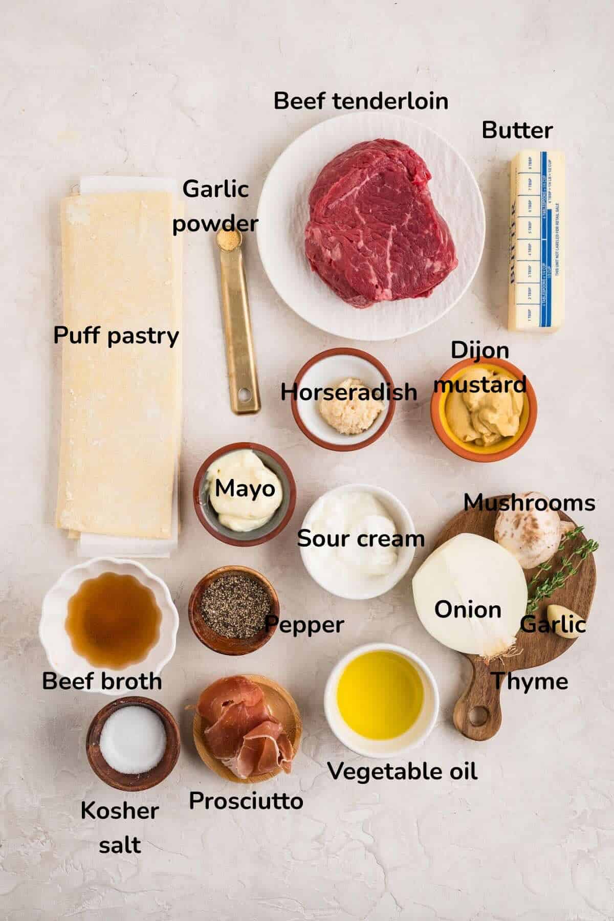 Ingredients for Beef Wellington Bites include beef tenderloin, mushrooms, thyme, horseradish, sour cream, mayo, and puff pastry.