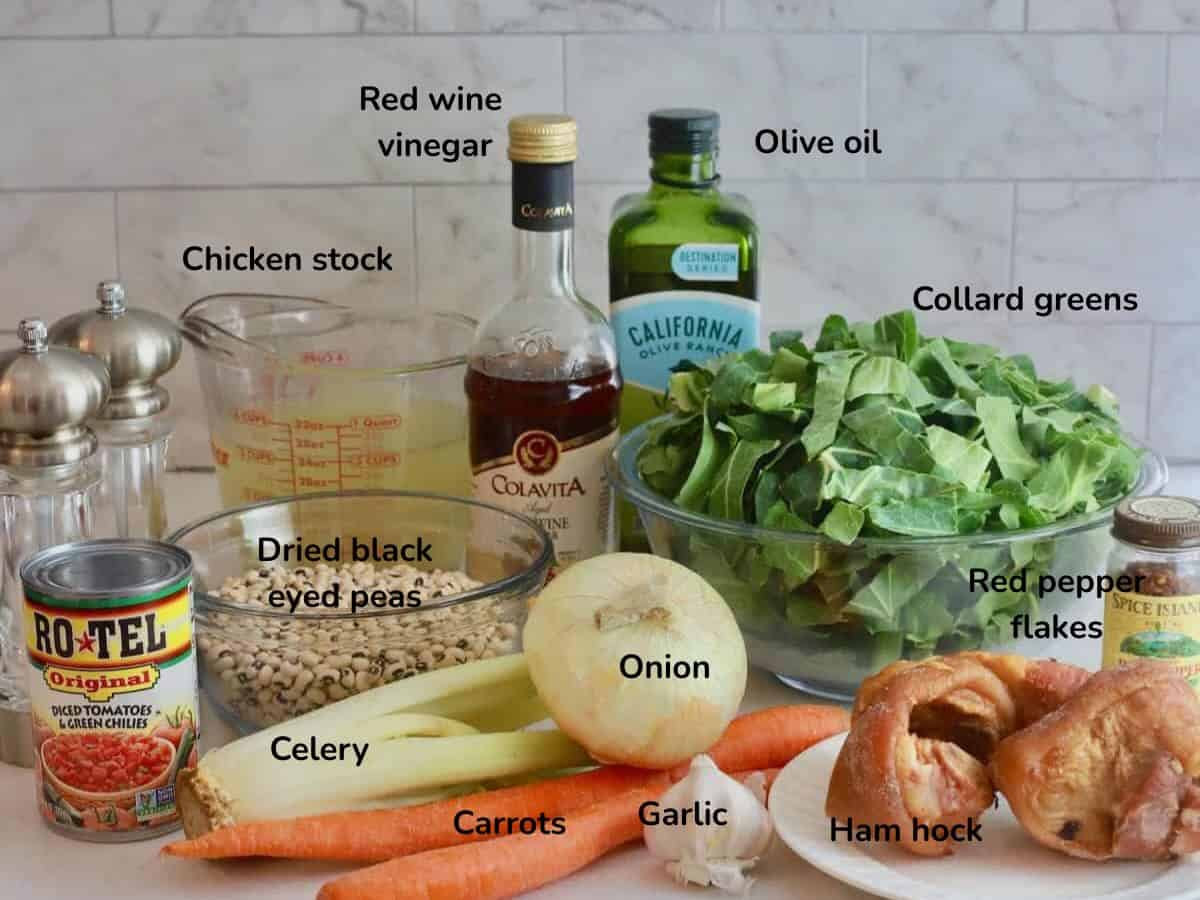 Ingredients for black-eyed peas soup include dried black eyed peas, collards, chicken stock, onion, celery, and carrots.