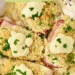 Pinterest pin for Chicken Cordon Bleu Casserole with it in a white baking dish topped with sauce, plus text.