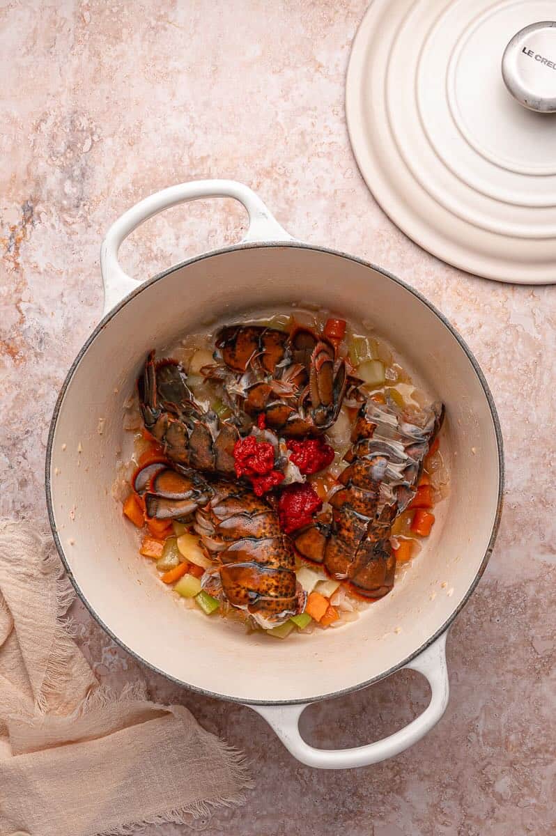 Cooked veggies and lobster tail shells to make lobster bisque.