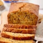 Pinterest pin with a loaf of sweet potato bread cut into slices, plus text.