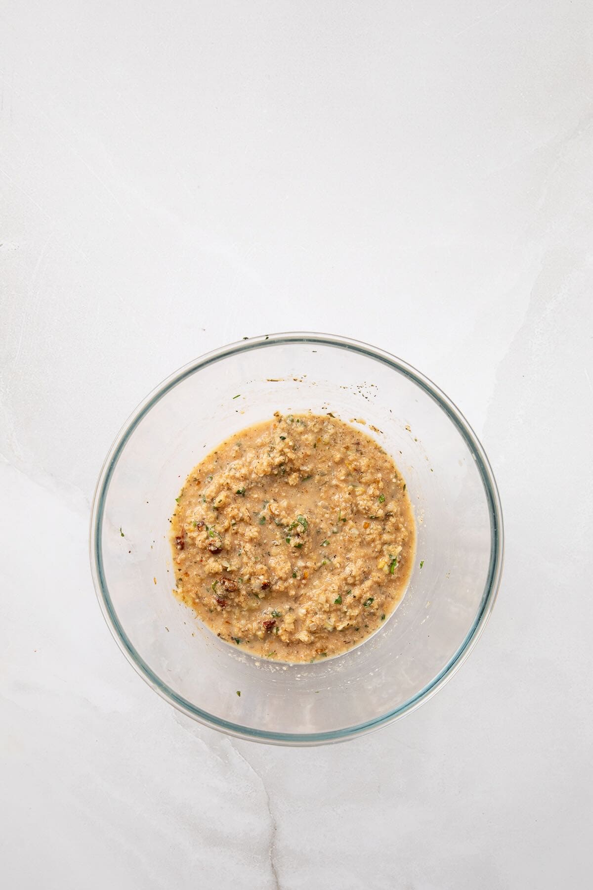 Breadcrumbs, Parmesan cheese, and herbs are added.